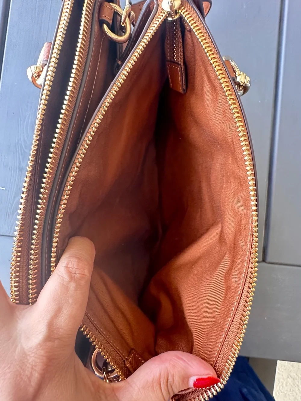 Coach Christie Carryall in a brown, textured leather with gold-tone hardware